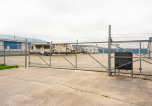 Fenced and gated outdoor RV and trailer storage lot at All Seasons Storage in Franksville, WI